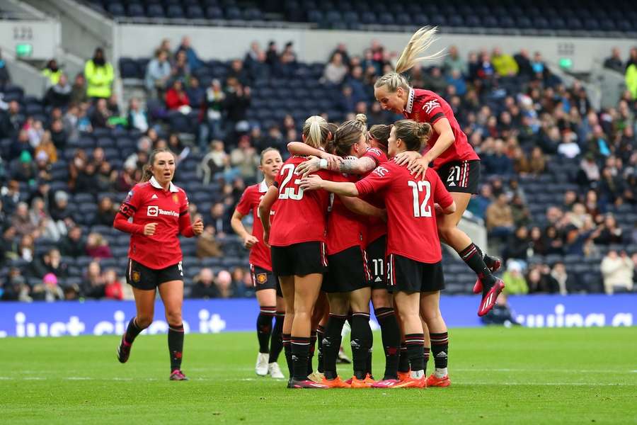 Manchester United players celebrate scoring against Tottenham