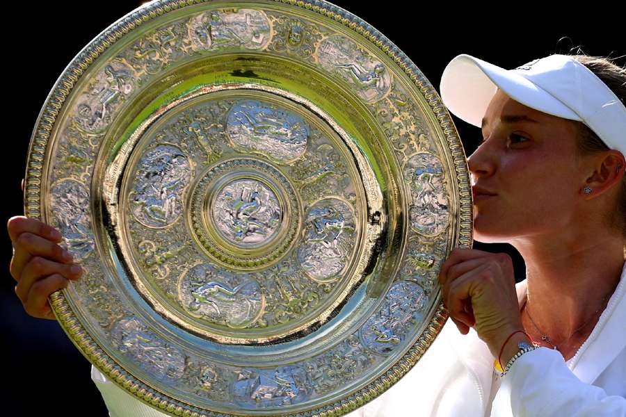 Elena Rybakina poses with the trophy after winning Wimbledon in 2022