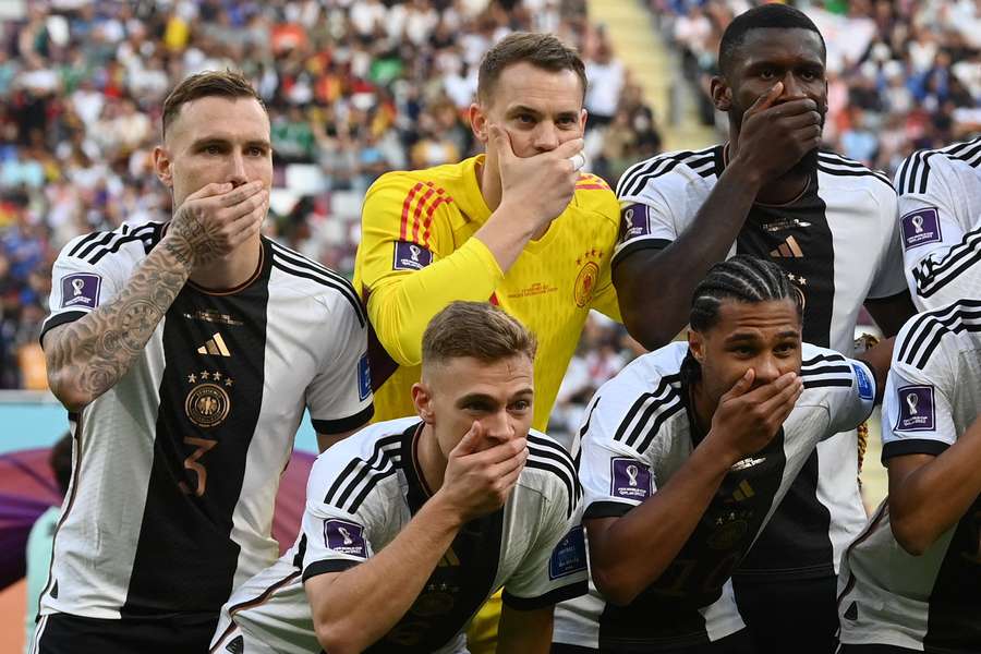 Germany covered their mouths to send a clear message to FIFA over their handling of the 'OneLove' armband threatened sanctions