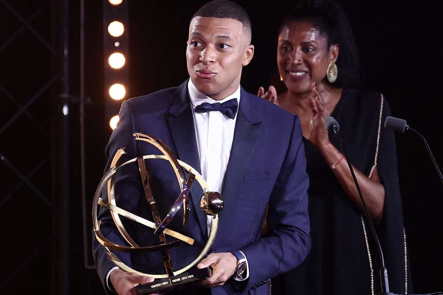 Paris Saint-Germain's French forward #07 Kylian Mbappe celebrates after receiving the Best Players Ligue 1 Award 