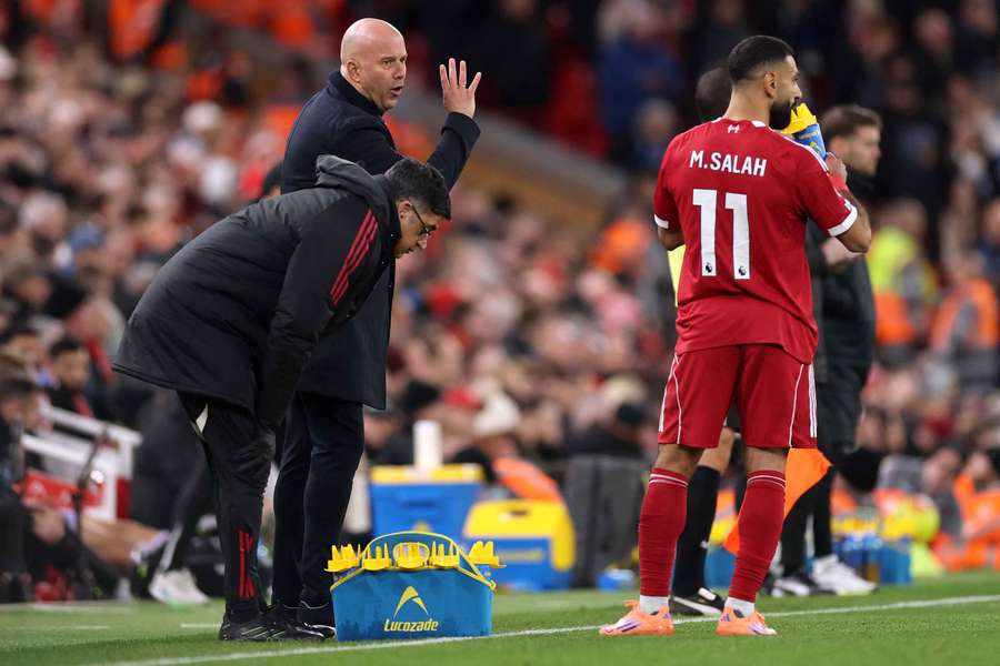 Liverpool boss Arne Slot talks to Mohamed Salah