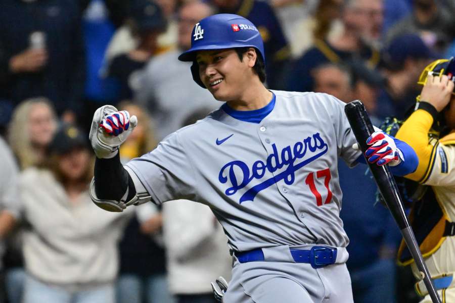 Shohei Ohtani gestures to fan