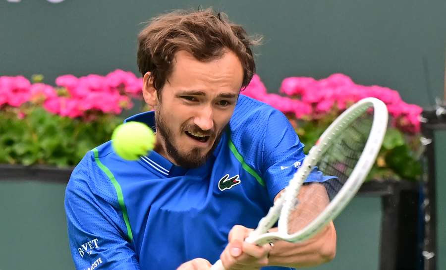 Daniil Medvedev of Russia hits a backhand return