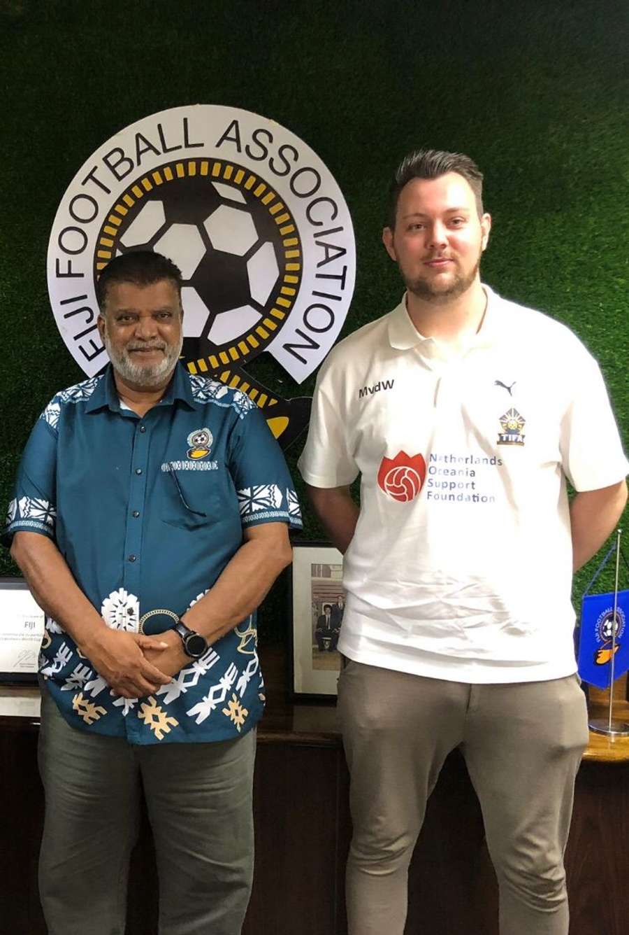 Michiel van der Werf (R) next to TIFA president Mohammed Yusuf