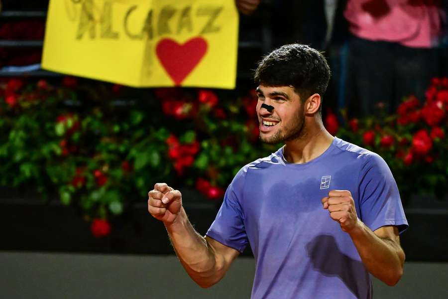 Carlos Alcaraz celebrates after winning his match against Laslo Djere on Sunday