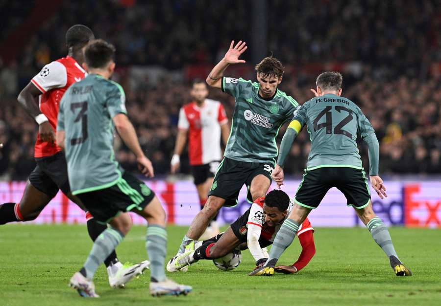 Matthew O'Riley vies with Feyenoord's Quinten Timber