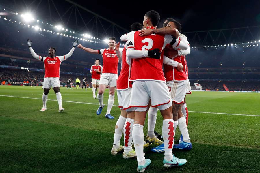 Arsenal celebrate scoring their opening goal against Lens