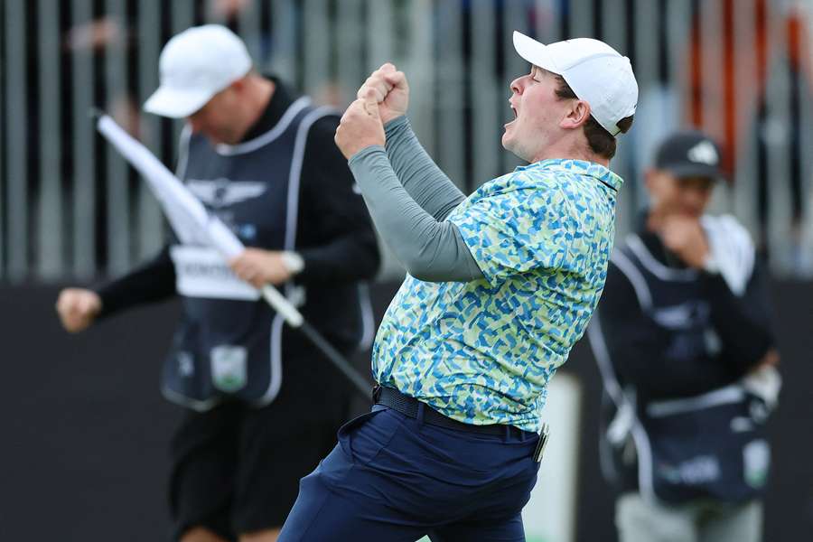 MacIntyre celebrates after sinking his winning putt on the 18th