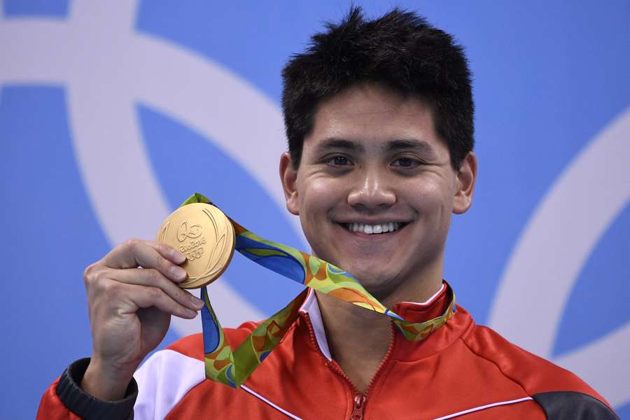 Schooling poses with his gold medal at Rio 2016