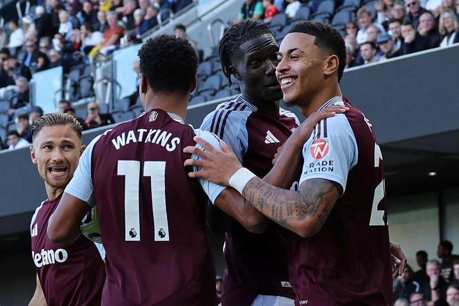 Aston Villa players celebrate their first goal