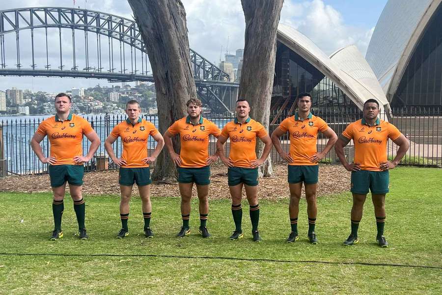 Angus Bell, Max Jorgensen, Fraser McReight, Dylan Pietsch, Joseph Suaalii and Allan Alaalatoa pose in the Australian jersey for the 2025 Lions tour