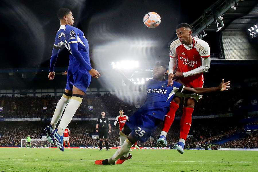 Arsenal's Gabriel in action with Chelsea's Moises Caicedo and Levi Colwill