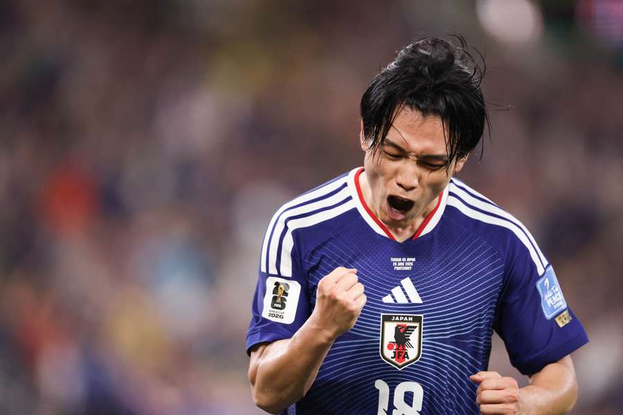 Japan's Ayase Ueda celebrates scoring against Tunisia Japan's Ayase Ueda celebrates scoring against Tunisia