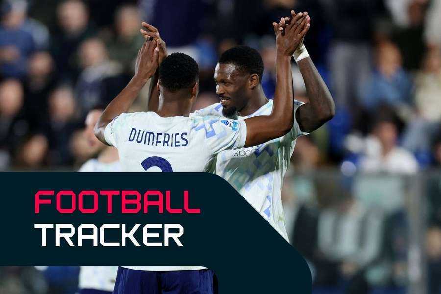 Inter Milan's Denzel Dumfries (left) celebrates scoring