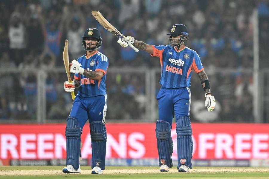 India's captain Suryakumar Yadav (R) celebrates after scoring a half-century India's captain Suryakumar Yadav (R) celebrates after scoring a half-century