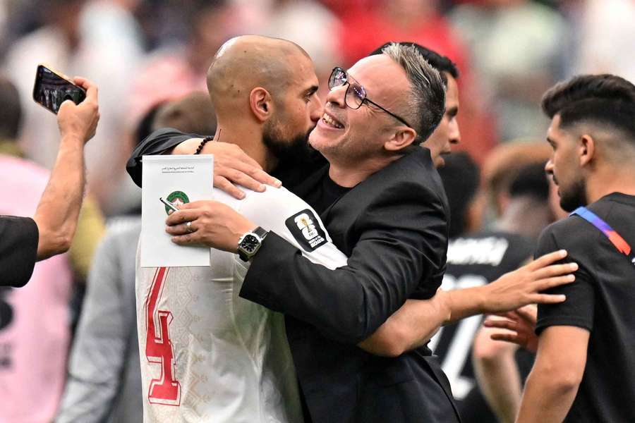 Morocco's Sofyan Amrabat and coach Mohamed Ouahbi celebrate after the win over Canada Morocco's Sofyan Amrabat and coach Mohamed Ouahbi celebrate after the win over Canada