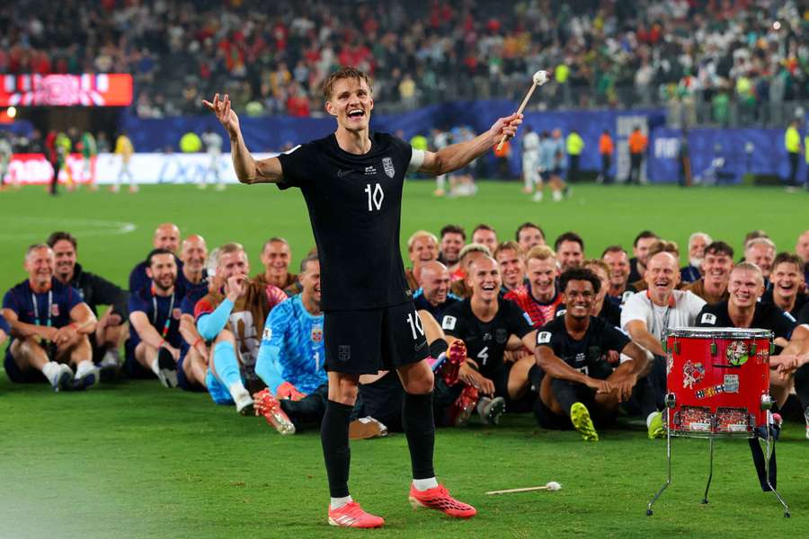 Norway's Martin Odegaard and teammates perform the traditional Viking rowing celebration for their fans