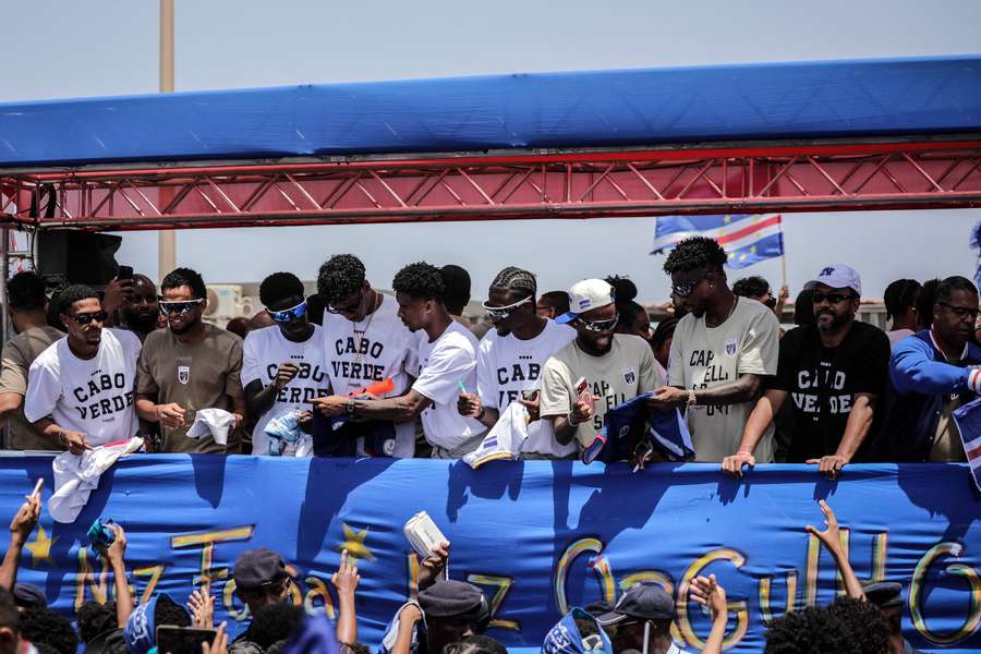 Supporters welcome Cape Verde's national team as they arrive at the airport in Praia from the World Cup