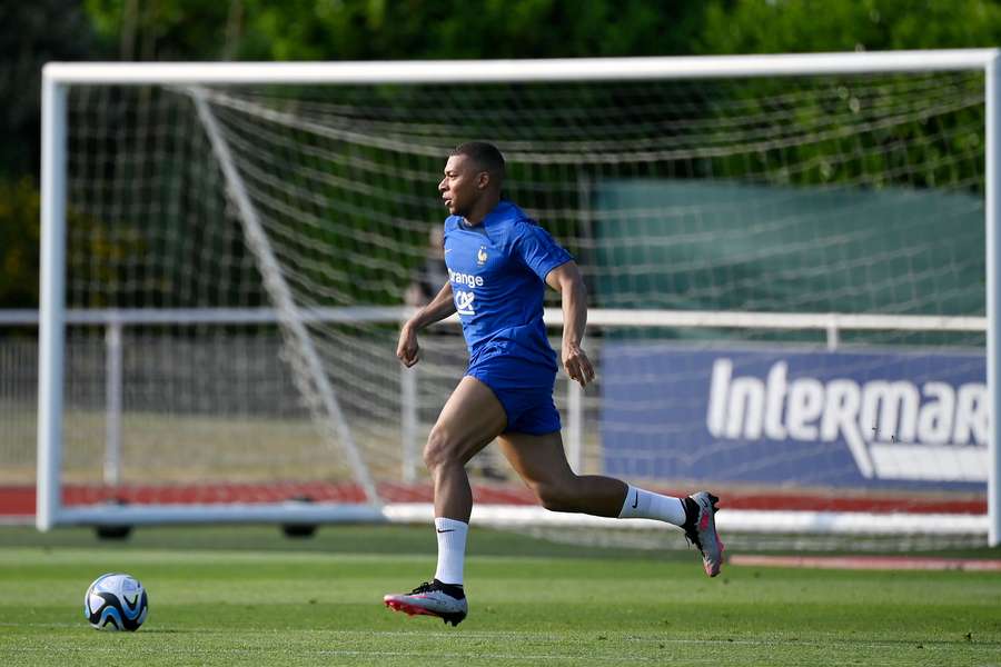 France forward Kylian Mbappe plays the ball during a training session