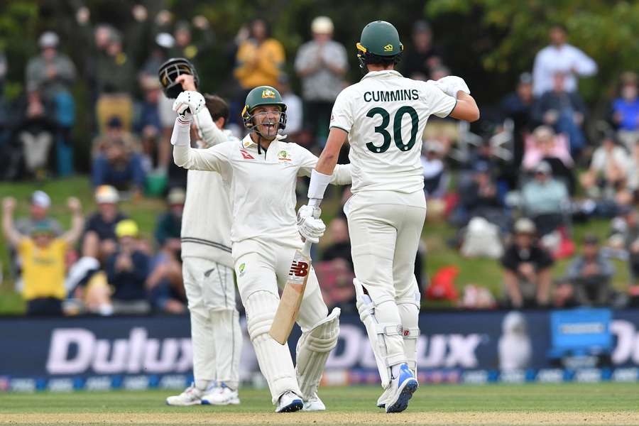 Alex Carey (L) and Pat Cummins celebrate Australia's second Test victory over New Zealand on Monday in Christchurch