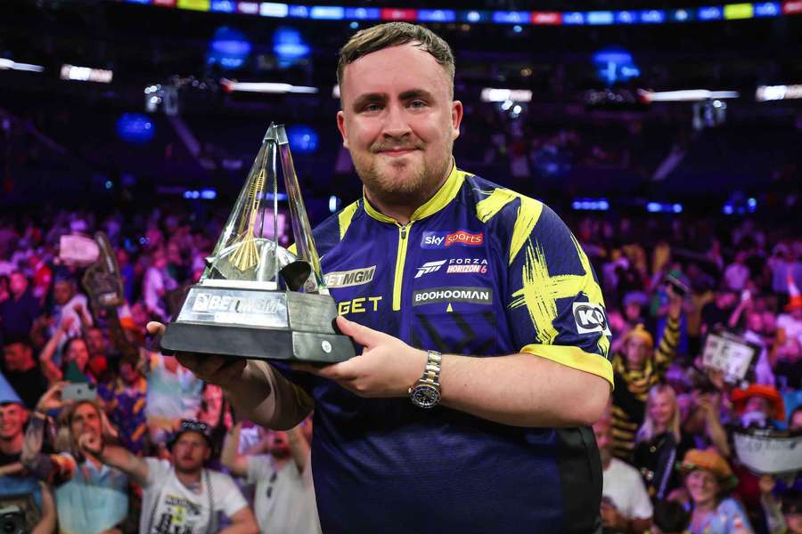 Littler poses with the Premier League trophy Littler poses with the Premier League trophy