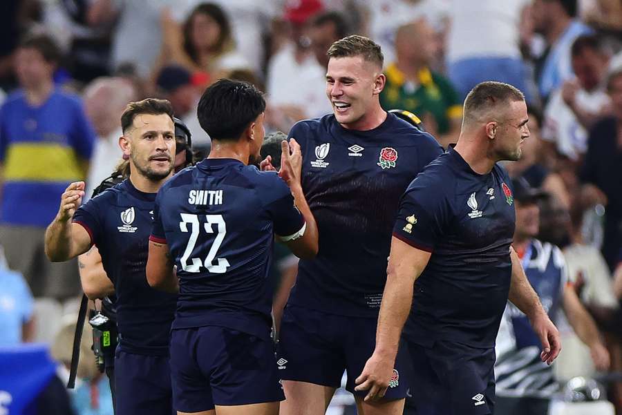 England's players celebrate after beating Argentina