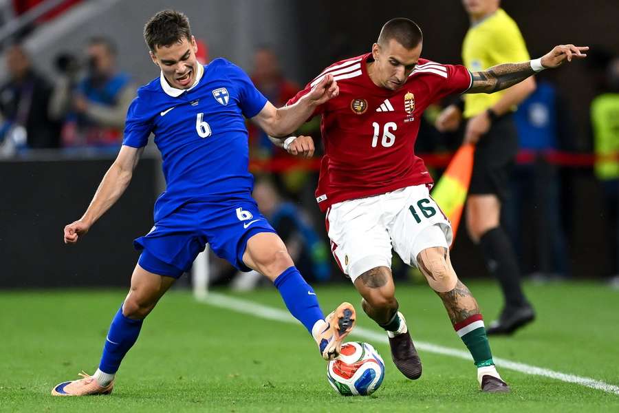 Leo Walta (left) tussles for possession against Hungary's Daniel Lukacs