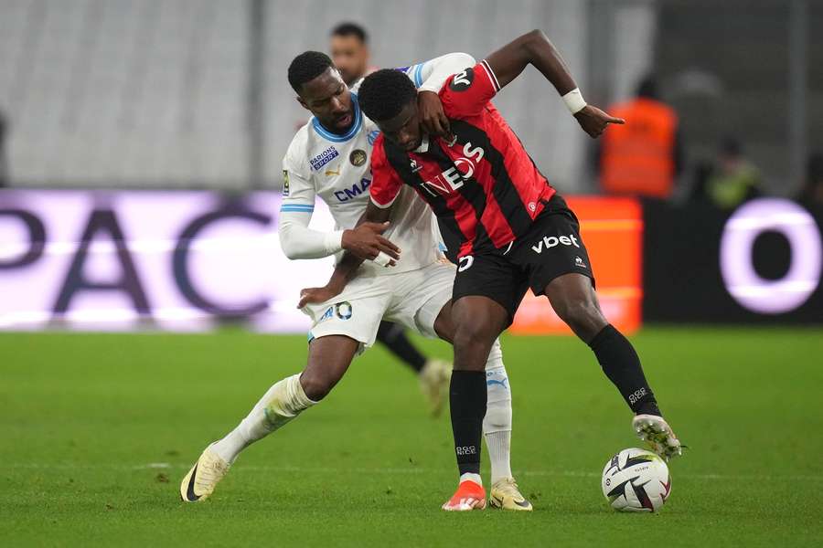 Marseille's Lopes Garcia, left, challenges for the ball with Nice's Mohamed-Ali Cho