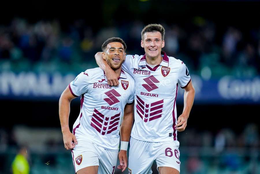 Che Adams (left) of Torino celebrates after scoring his side's third goal