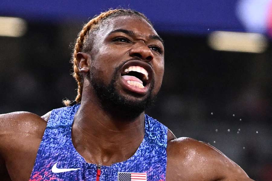 USA sprinter Noah Lyles crosses the finish line to win the men's 4x100m relay final