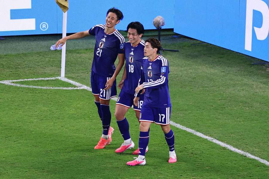Japan's Ayase Ueda celebrates scoring their fourth goal with Yuito Suzuki and Hiroki Ito Japan's Ayase Ueda celebrates scoring their fourth goal with Yuito Suzuki and Hiroki Ito