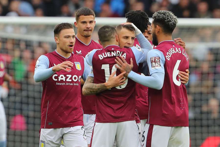 Lucas Digne (C) celebrates with teammates after putting Aston Villa 2-0 up against Manchester United.