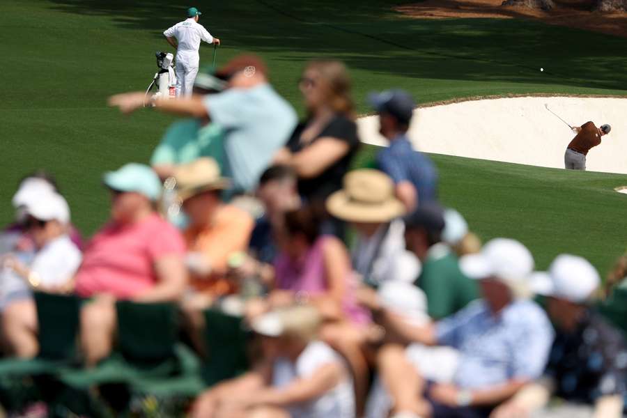 Adam Scott plays a shot on the eighth hole