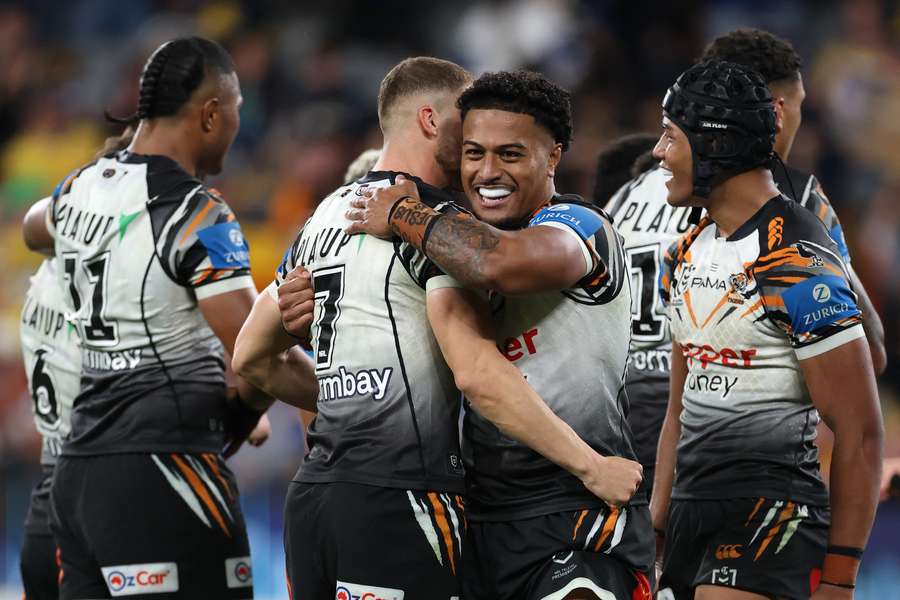 Wests Tigers players celebrate their epic Easter Monday victory. Wests Tigers players celebrate their epic Easter Monday victory.