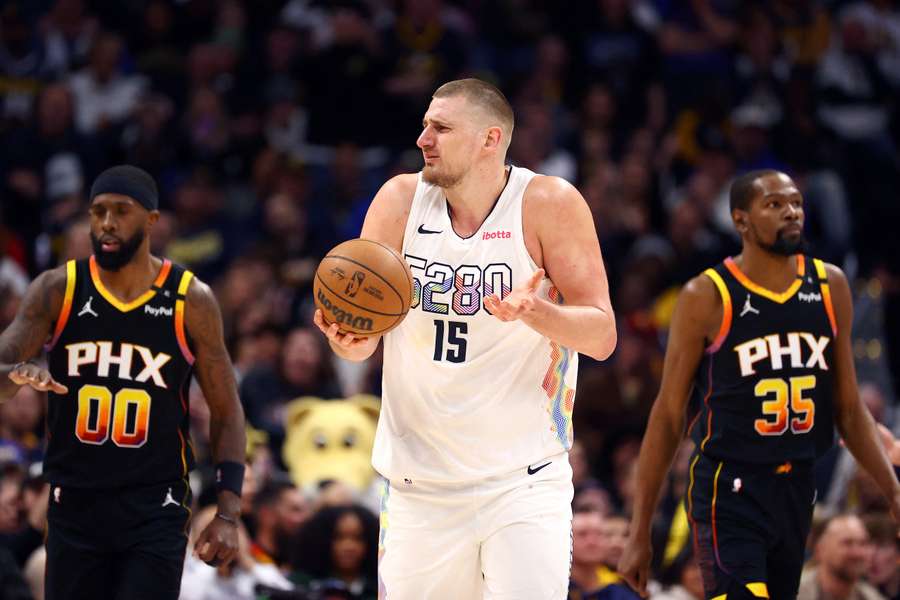 Jokic (centre) reacts during the fourth quarter against Phoenix Suns