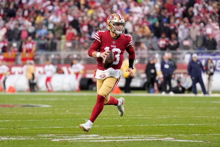 Brock Purdy #13 of the San Francisco 49ers scrambles against the Seattle Seahawks 