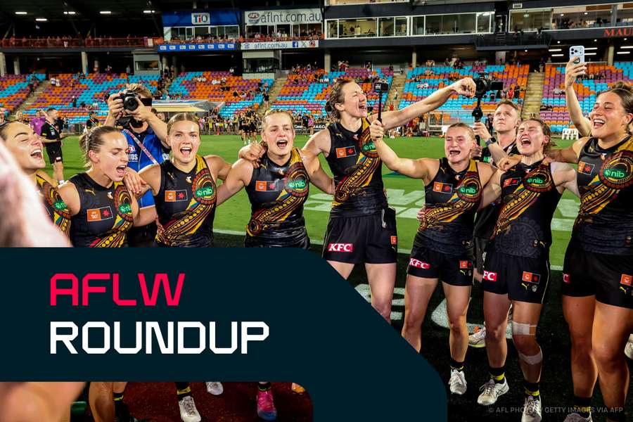 Richmond players celebrate their thrilling Dreamtime win over Essendon in Darwin. Richmond players celebrate their thrilling Dreamtime win over Essendon in Darwin.