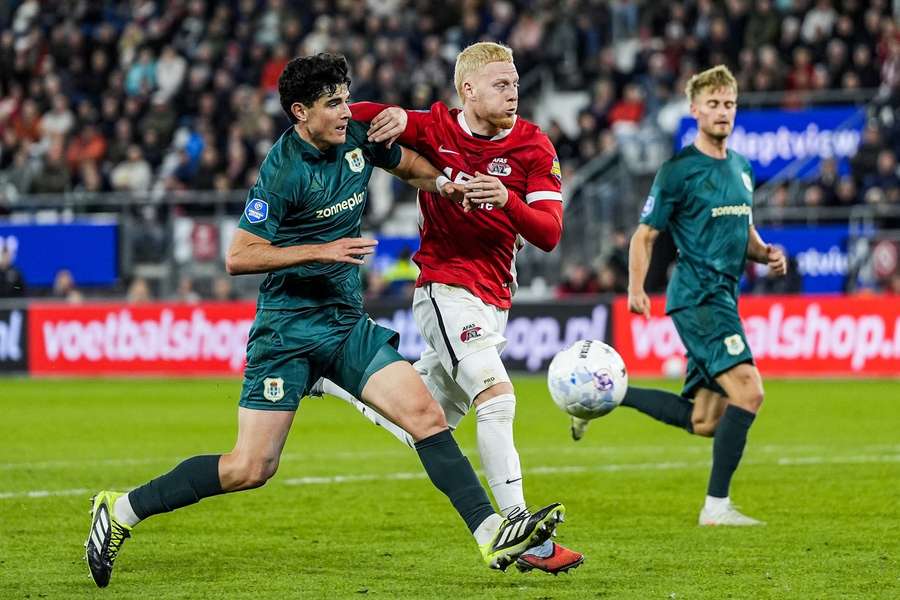 PEC's Anselmo Garcia MacNulty and Mexx Meerdink of AZ battle it out during Wednesday's Eredivisie match