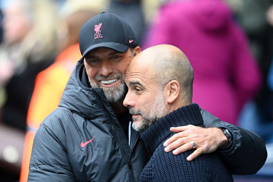 Klopp embraces Pep Guardiola prior to a match between the two sides in April 2023