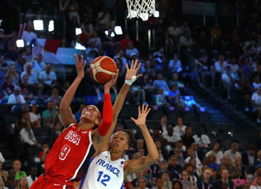 A'Ja Wilson of the United States in action with Iliana Rupert of France