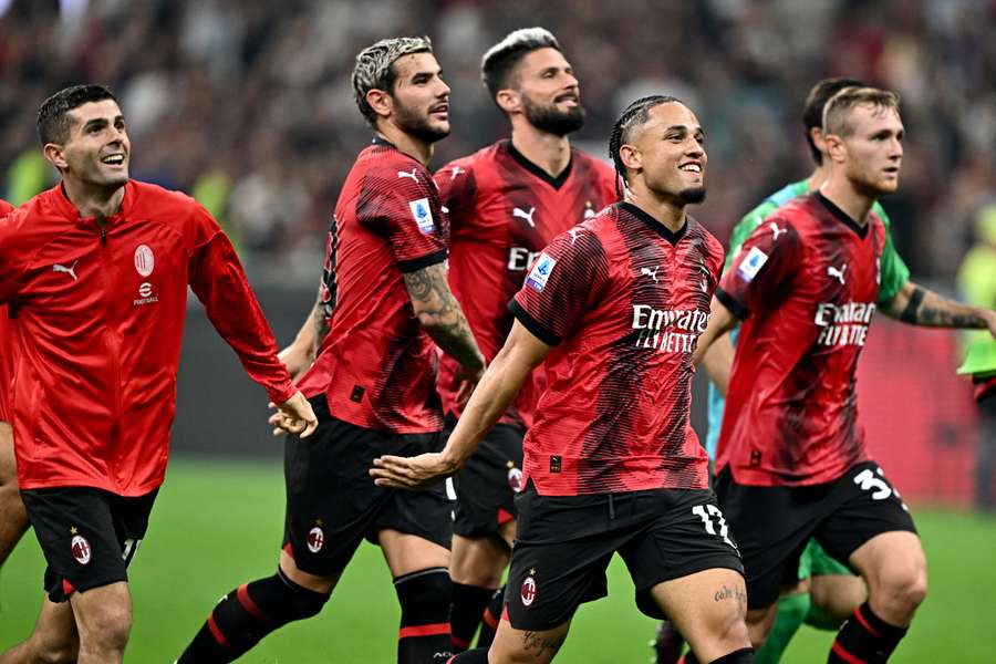 Milan's players celebrate their win