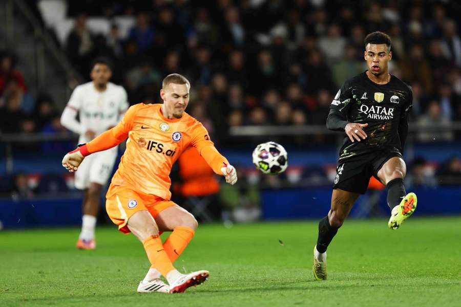 Filip Jorgensen in action against PSG in the Champions League