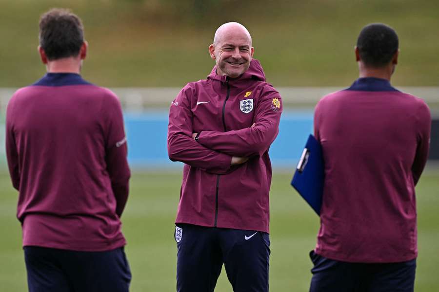 England interim manager Lee Carsley (C) takes a team training session