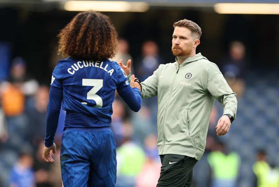 Chelsea's interim manager Calum McFarlane (R) with Marc Cucurella