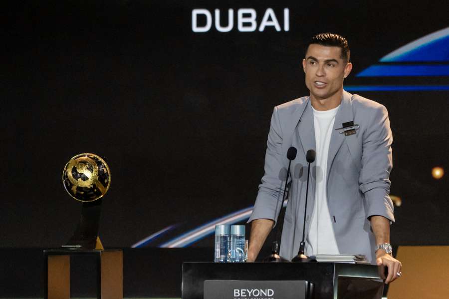 Cristiano Ronaldo gives a speech with his award during the Globe Soccer Dubai Awards 