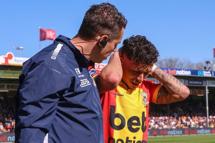 Go Ahead Eagles' Dean James looks distraught after coming off with an injury