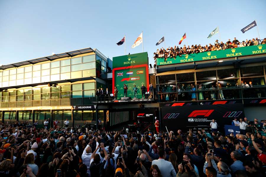 Red Bull's Max Verstappen celebrates on the podium after winning the Australian Grand Prix