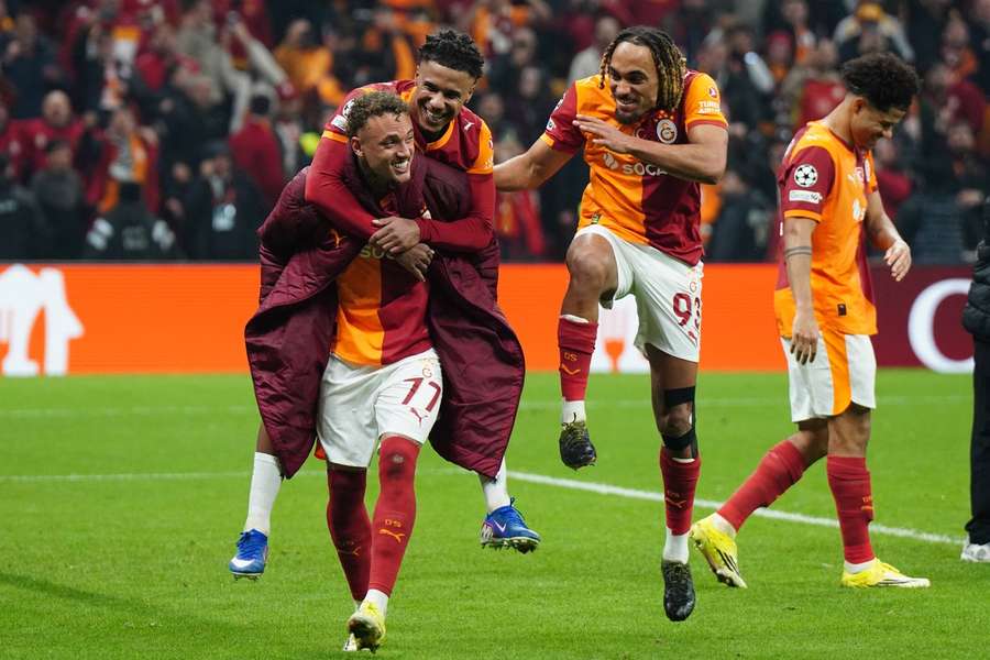Galatasaray's Nao Lang, Ismail Jakobs and Sacha Boey celebrate their win over Juventus