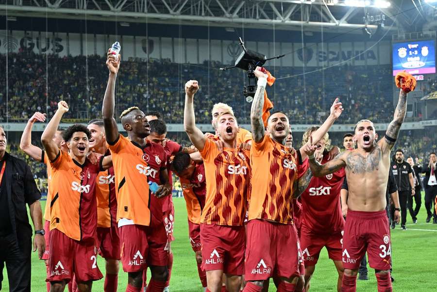 Galatasaray players celebrate after the game