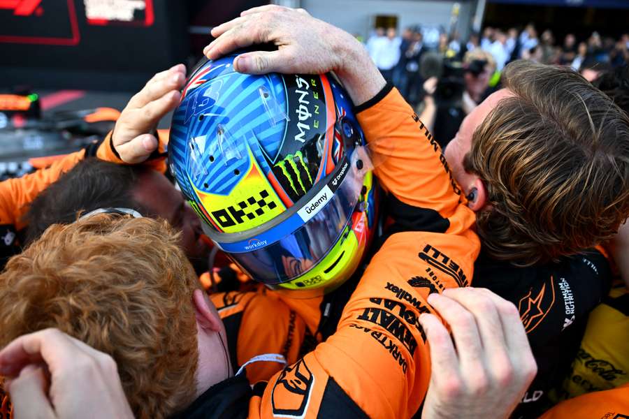 Oscar Piastri celebrates with teammates after winning the Azerbaijan Grand Prix